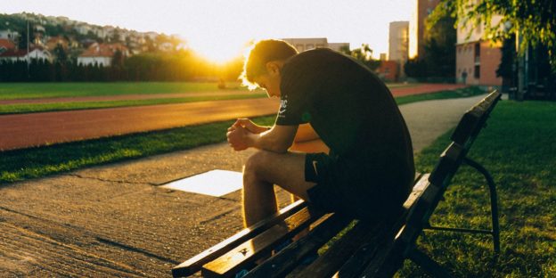 man sitting on bench