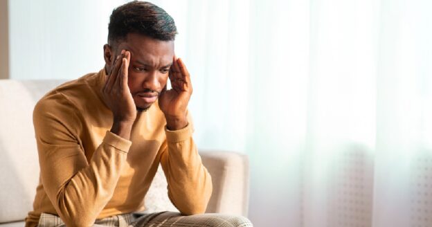 Man experiencing pain and anxiety