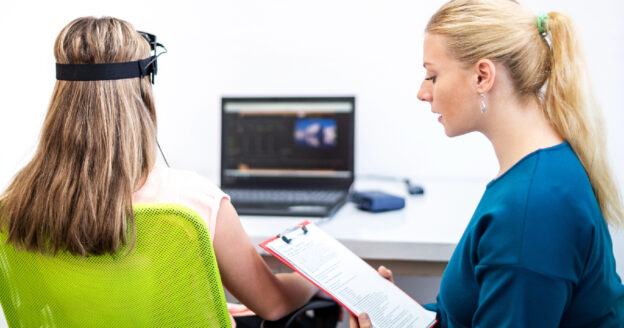 Woman and client practicing neurofeedback