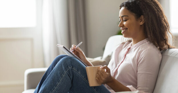 Woman writing in a journal